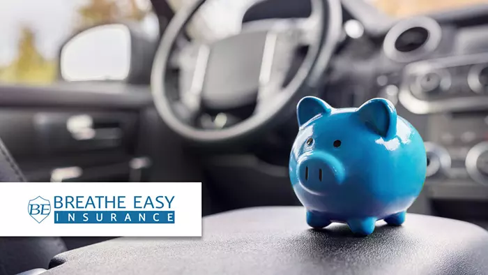 Inside image of a car with blue piggy bank on the seat and Breathe Easy logo